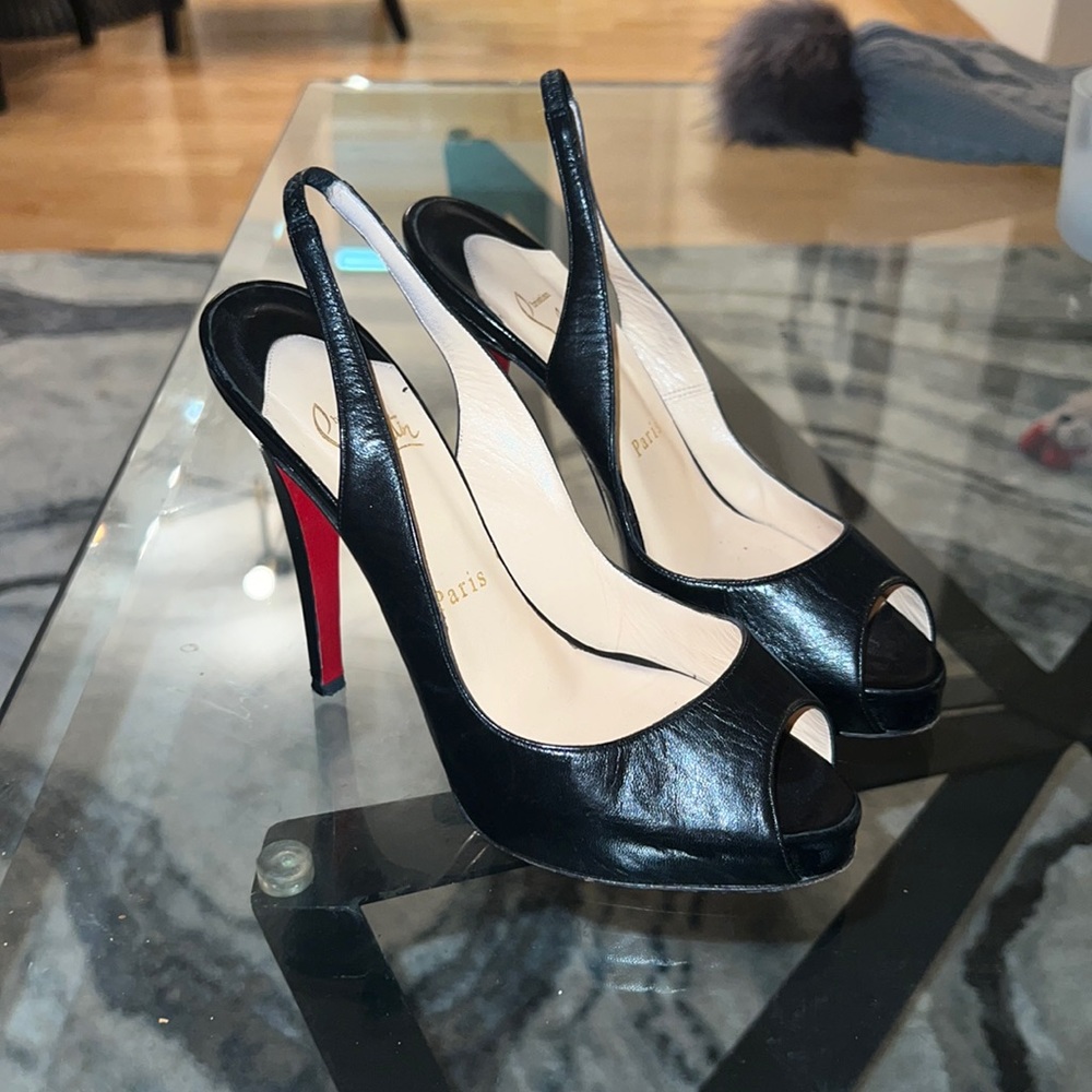 Christian Louboutin size 37 peep toed slingback heels. Worn one time.